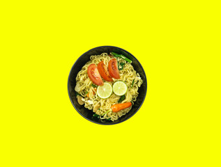 Indonesian Mie Goreng Nyemek or Fried Noodle with egg traditional Indonesian or Chinese food with mustard greens