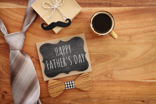 top view image of fathers day composition with vintage father's accessories and blackboard