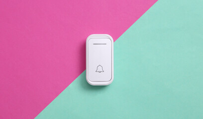 Doorbell on a blue pink background. Minimalism