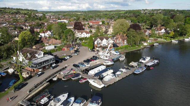 River Thames at Bourne End boats moored on waterfront , UK Buckinghamshire Aerial footage