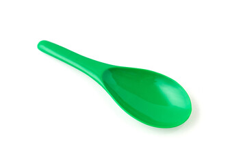 Green color of plastic spatula isolated on white background.