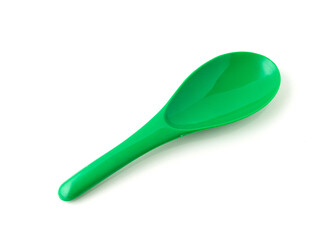 Green color of plastic spatula isolated on white background.