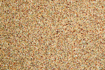 Texture of small stones, rocky abstract background, grainy surface, gravel pattern, red pebbles. Decorative design, brown colored. Grunge wall backdrop.
