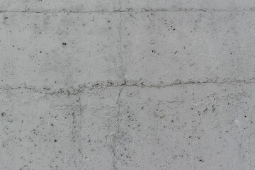 Textured concrete wall for the backdrop. Dark Gray color. Pieces of paint, cracks, pores.