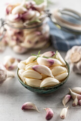 Ripe and aromatic homegrown garlic served in the blue rustic bowl