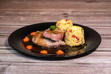 Recipe for roasted veal in butter, piquillo pesto, canele of polebta with crunchy vegetables, honey rosemary sauce. High quality photo