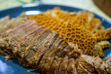 A delicious Chinese dish, a platter of braised vegetables, tripe and beef tongue
