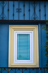 Fototapeta na wymiar vintage windows on the blue wall