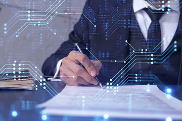 A client in dark blue suit is signing a contract to create a new software to present it in start up...