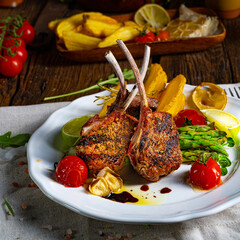 Lamb chops marinated in herbs with green asparagus and lime