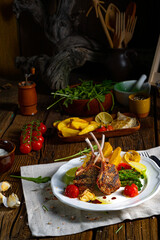 Lamb chops marinated in herbs with green asparagus and lime
