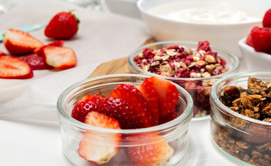 Ingredients for a healthy breakfast. Muesli, berries and yogurt. Healthy eating. Sports fitness menu. Concept.