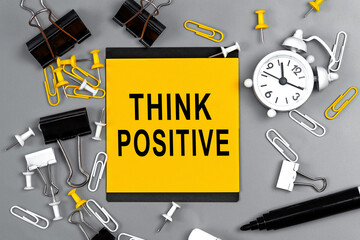 Think positive - concept of text on sticky note. Work and study concept