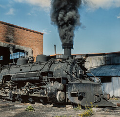 Fototapeta na wymiar Steam locomotive. Train. On steam. Chama New Mexico USA. Rio Arriba County. Cumbres and Toltec Scenic Railroad