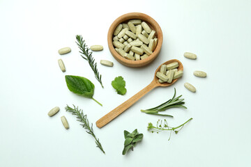 Concept of herbal medicine pills on white background, top view