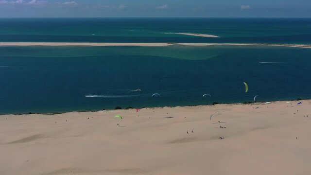  Paragliders fly over the Dune of Pilat Dune du Pilat , Arcachon, France. Largest sand dune in Europe.