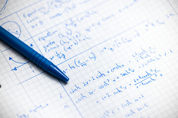 Math handwriting in notebook closeup