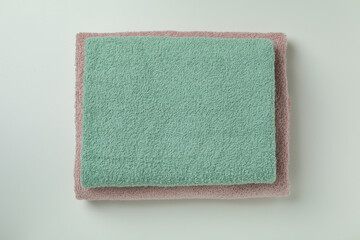Fototapeta premium Clean folded towels on light gray background, top view