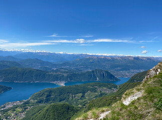 Fototapeta na wymiar Panorama View from Top of Monte Genereso, Ticino, Switzerland. View to Lugano city, San Salvatore mountain and Lugano lake. 