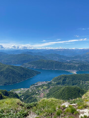 Fototapeta na wymiar Panorama View from Top of Monte Genereso, Ticino, Switzerland. View to Lugano city, San Salvatore mountain and Lugano lake. 