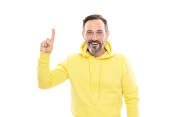 Fototapeta premium handsome mature man with moustache in hoody pointing finger up isolated on white, announcer.