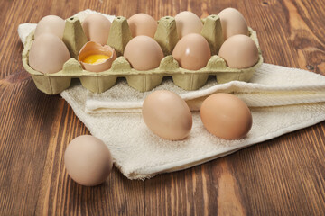 Cardboard egg box on wooden table. Top view