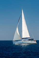 Fototapeta premium a sailingboat at sea outside the coast of Corsica