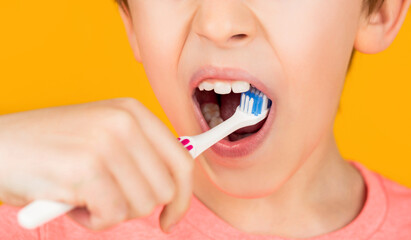 Little boy cleaning teeth with kids toothbrush. Dental hygiene. Little man brushing teeth. Happy child kid boy with toothbrush. Health care, dental hygiene