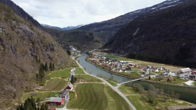 Modalen river and farms - Showing valley with farmland houses and bridge - Norway aerial
