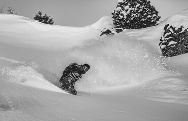 Skier rides on fresh snow against blue sky