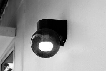 Beautiful lamp on white wall.