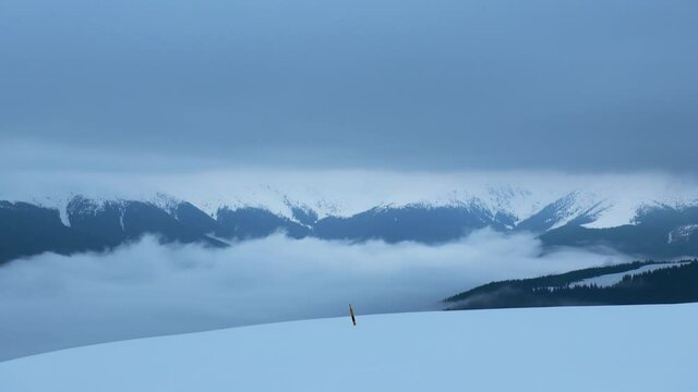 A time-lapse of The Iezer Mountains covered in the fog and snow in Romania shot in HD
