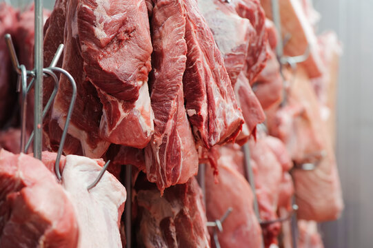 beef meat hanging in a butcher shop