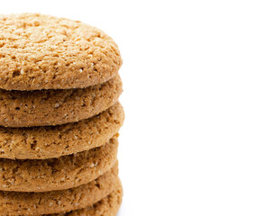 Stack of oatmeal cookies, on white background isolated in close-up with place for text, copyspace