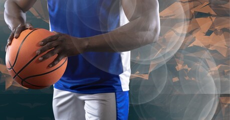 Composition of midsection of basketball player holding ball with copy space