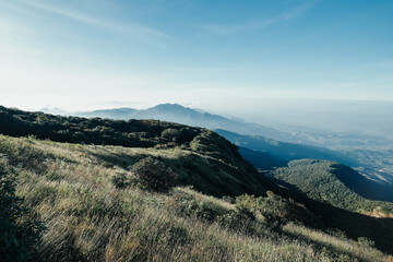 beautiful blue sky high peak mountains green forest guiding for backpacker camping backpacking hiking idea long weekend at Kew Mae Pan Nature Trail Waterfall Doi Inthanon, Chiang Mai, Thailand.