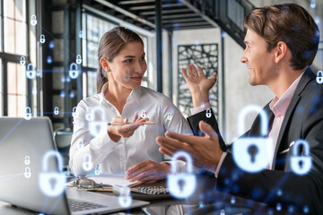 Businessman and businesswoman working together to protect clients confidential information and...