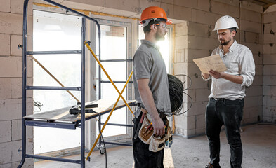 Two builders collaborate to build a new home.