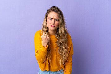 Fototapeta premium Young Brazilian woman isolated on purple background with unhappy expression