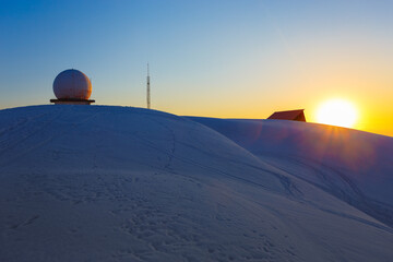 Meteo station in the winter sunset in the mountains