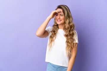 Naklejka premium Young Brazilian woman isolated on purple background laughing