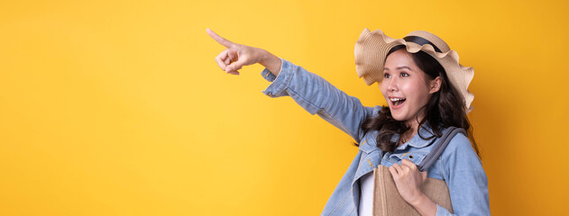 Nice looking Asian female traveler with suitcase and hats to travel during the holidays. backpacker and go to travel in weekend concept. Thing an amazing surprise, wow