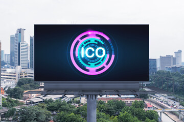 ICO hologram icon on billboard over panorama city view of Kuala Lumpur at day time. KL is the hub...