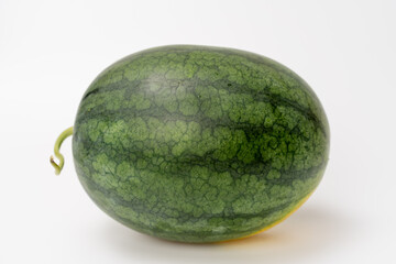 A whole watermelon on a white background