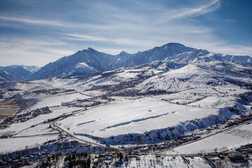 Mountains in Uzbekistan in winter against the blue sky