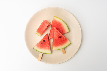 There is watermelon ice cream on the plate