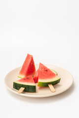 There is watermelon ice cream on the plate