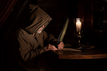 Monk in the Middle Ages writes old letter