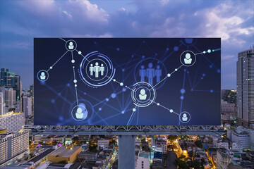 Glowing Social media icons on billboard over night panoramic city view of Bangkok. The concept of networking and establishing new connections between people and businesses in Southeast Asia