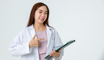 Asian doctor pointing aside in studio